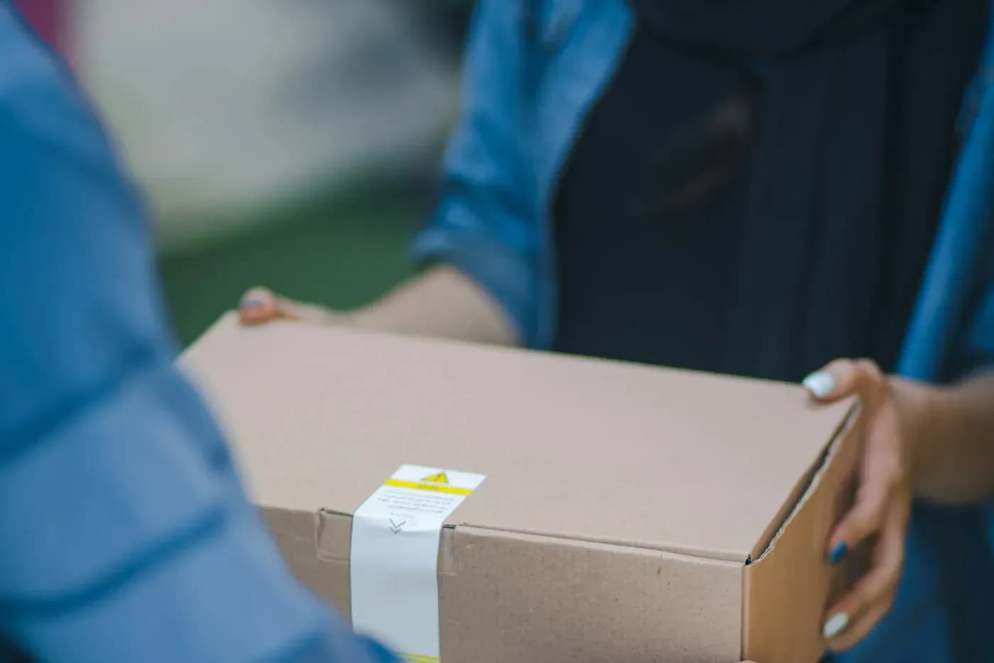 Same-day courier handing over a parcel